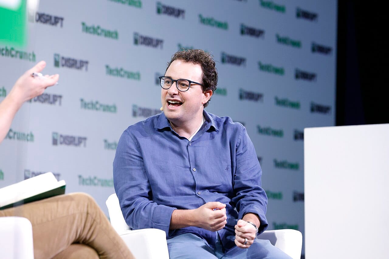 AI Divide analysis featuring Dario Amodei, Anthropic CEO, discussing AI risks to white-collar jobs