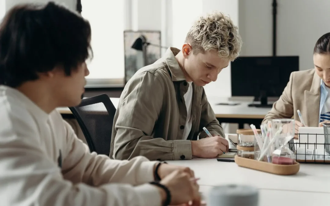 AI Entry-Level Jobs illustration showing young corporate workers collaborating and reviewing tasks in a modern office